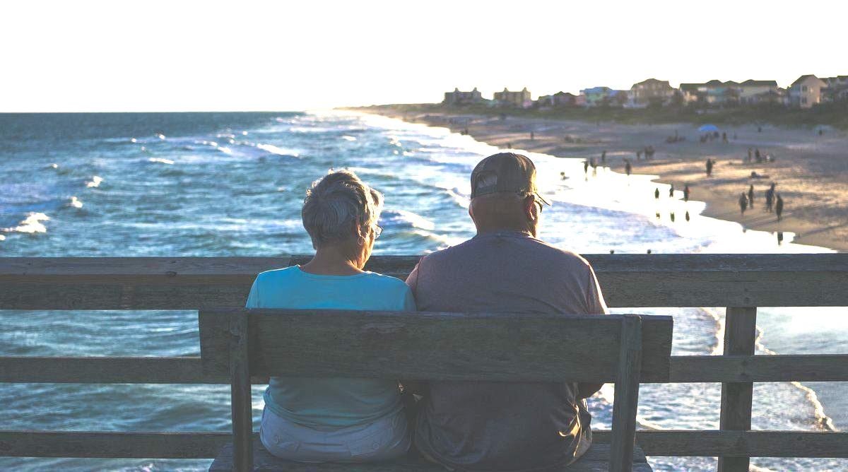 lovely older couple enjoying the sunset together